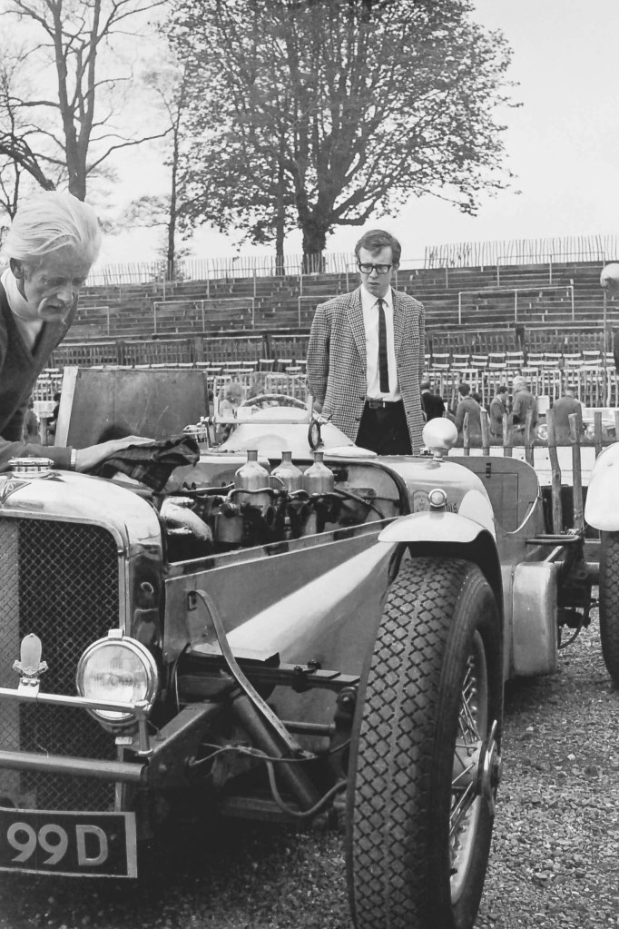 Photo 7 with Jim Kennard peering at the 4.3 engine.