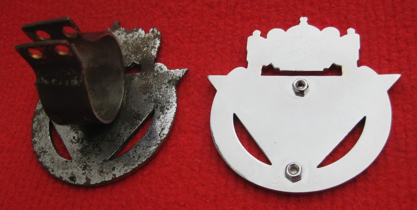 The reverse of the badge showing an original badge with its clip designed for Speed Models and the fixing on the replica